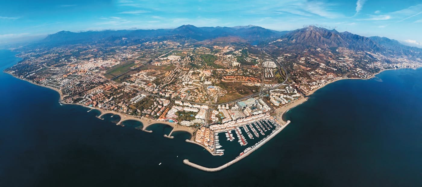Panoramic aerial view of Marbella, its coastline and the surrounding mountains